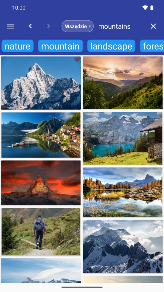 FreePics po polsku ze zdjęciami gór z Pixabay, tagami tematycznymi i przyciskami ulubionych.